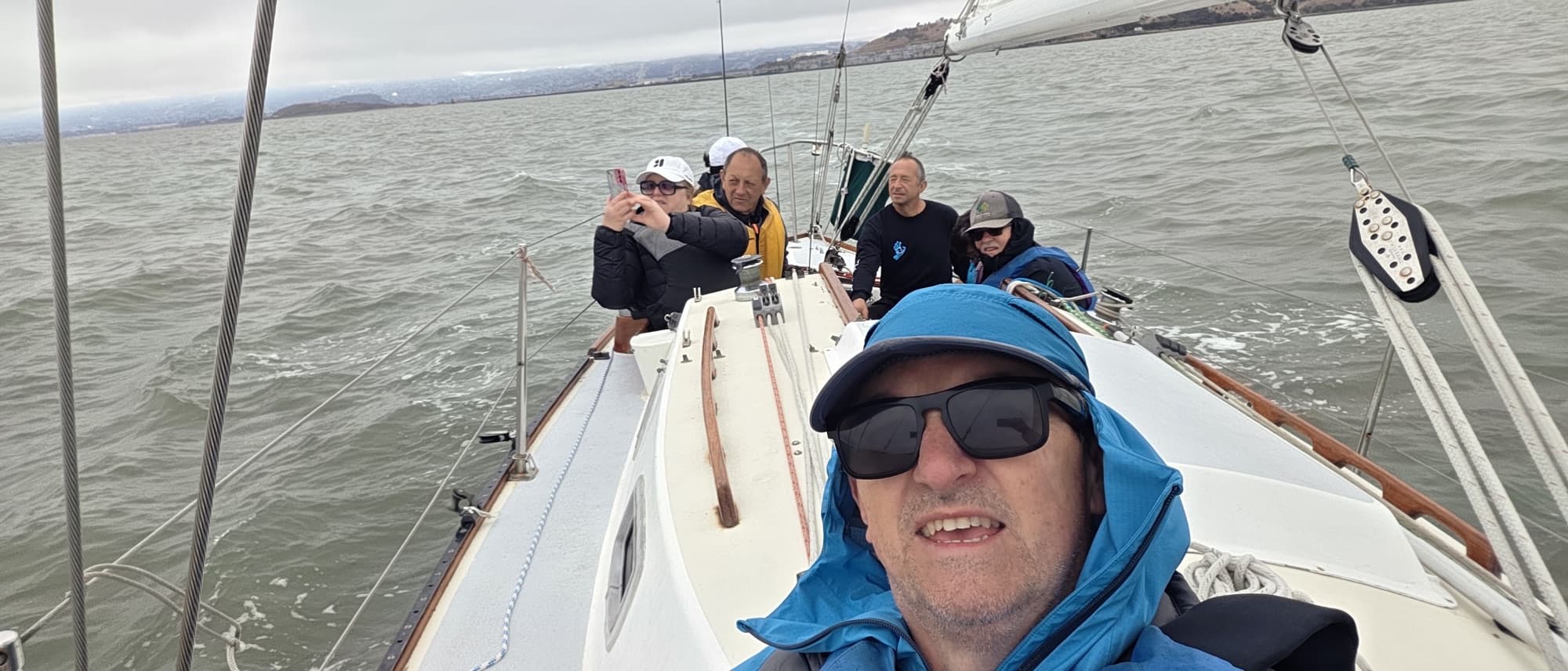 Romi sailing on San Francisco Bay with crew aboard